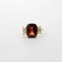 18CT YG GARNET & BAGUETTE DIAMOND THREE STONE RING