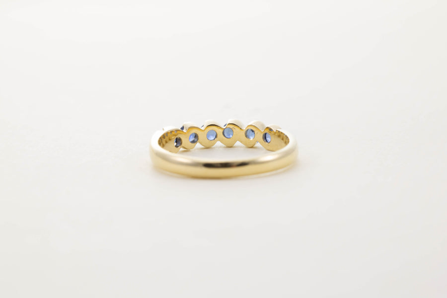 9CT YG SIX STONE SAPPHIRE TWIST HALF ETERNITY RING