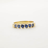 9CT YG SIX STONE SAPPHIRE TWIST HALF ETERNITY RING