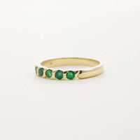 9CT YG SIX STONE EMERALD TWIST HALF ETERNITY RING