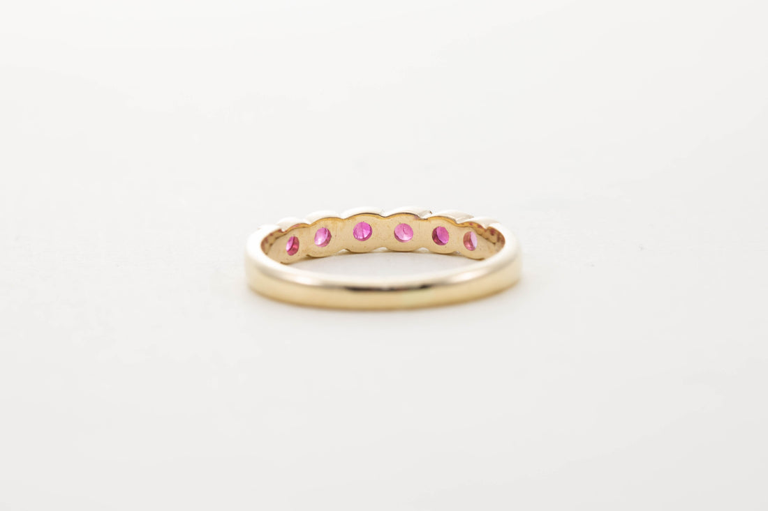 9CT YG SIX STONE RUBY TWIST HALF ETERNITY RING