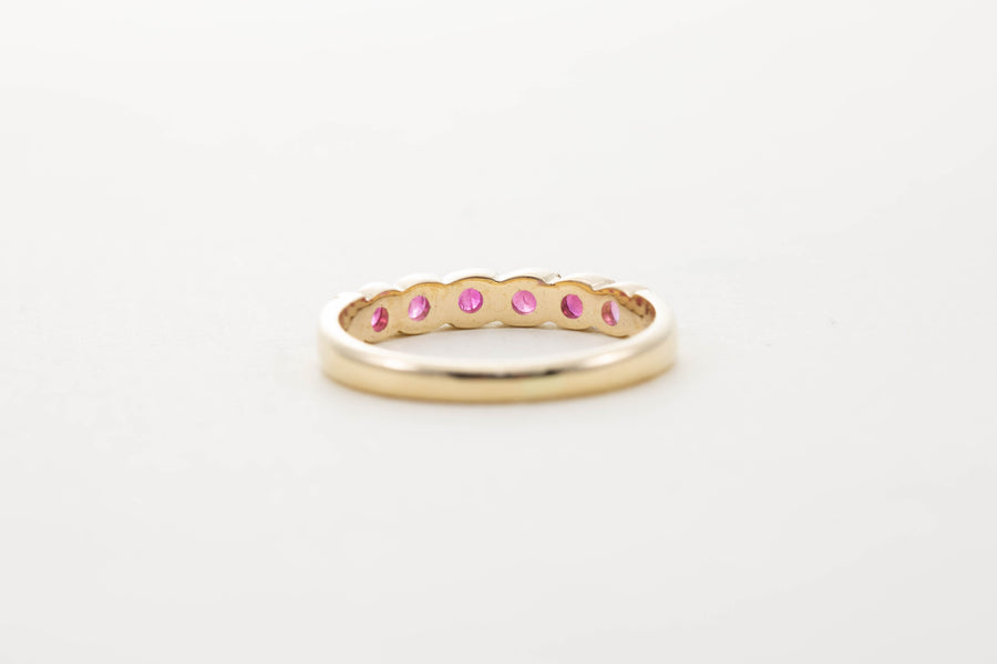 9CT YG SIX STONE RUBY TWIST HALF ETERNITY RING