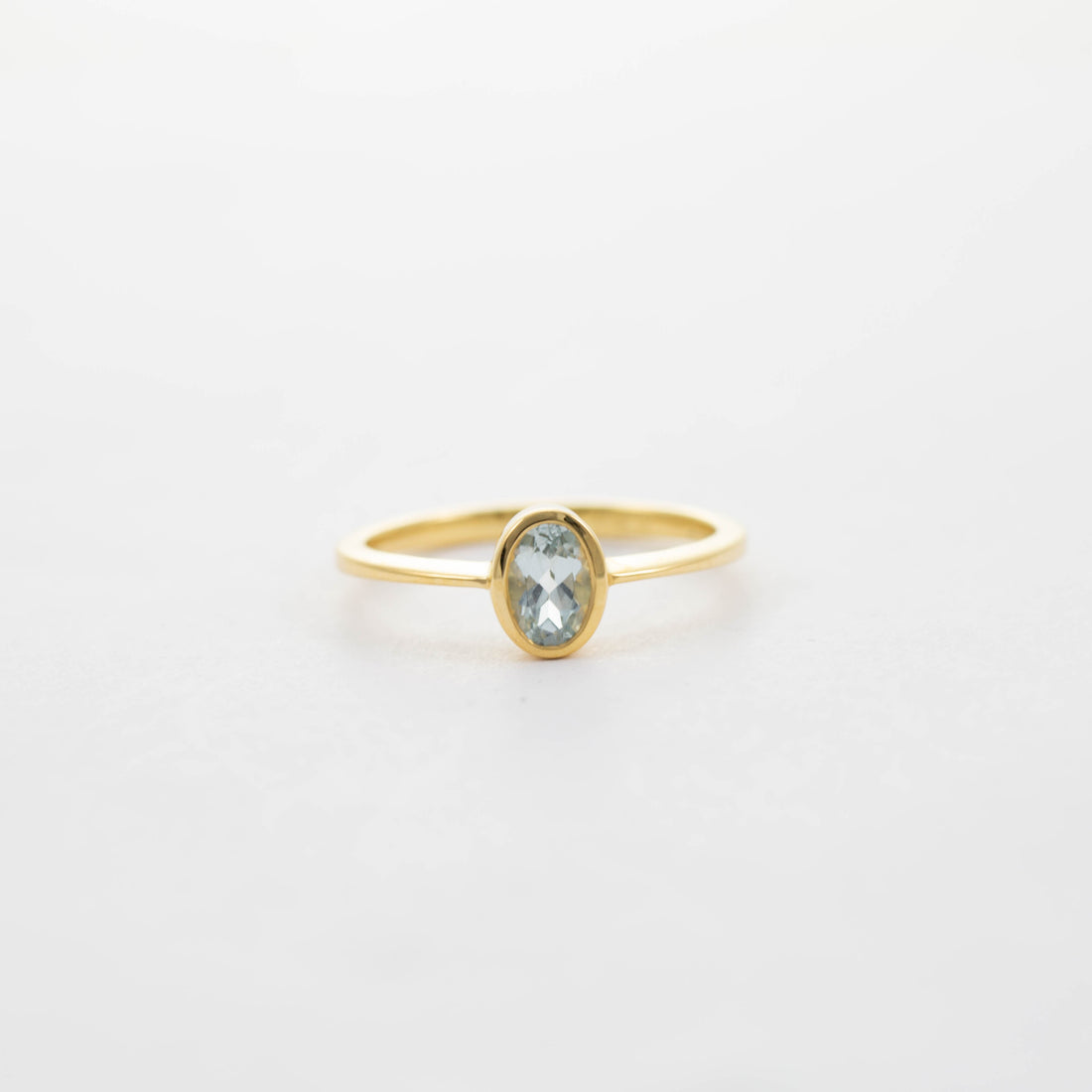 9CT YG SMALL OVAL AQUA SOLITAIRE RING 0.39ct