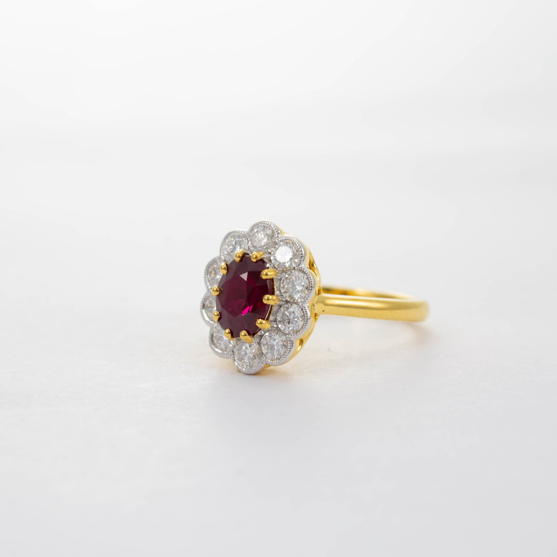 18CT YG RUBY & DIAMOND CLUSTER RING