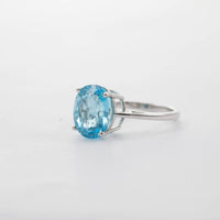 9CT WG LARGE OVAL BLUE TOPAZ SOLITAIRE RING 6.17CT