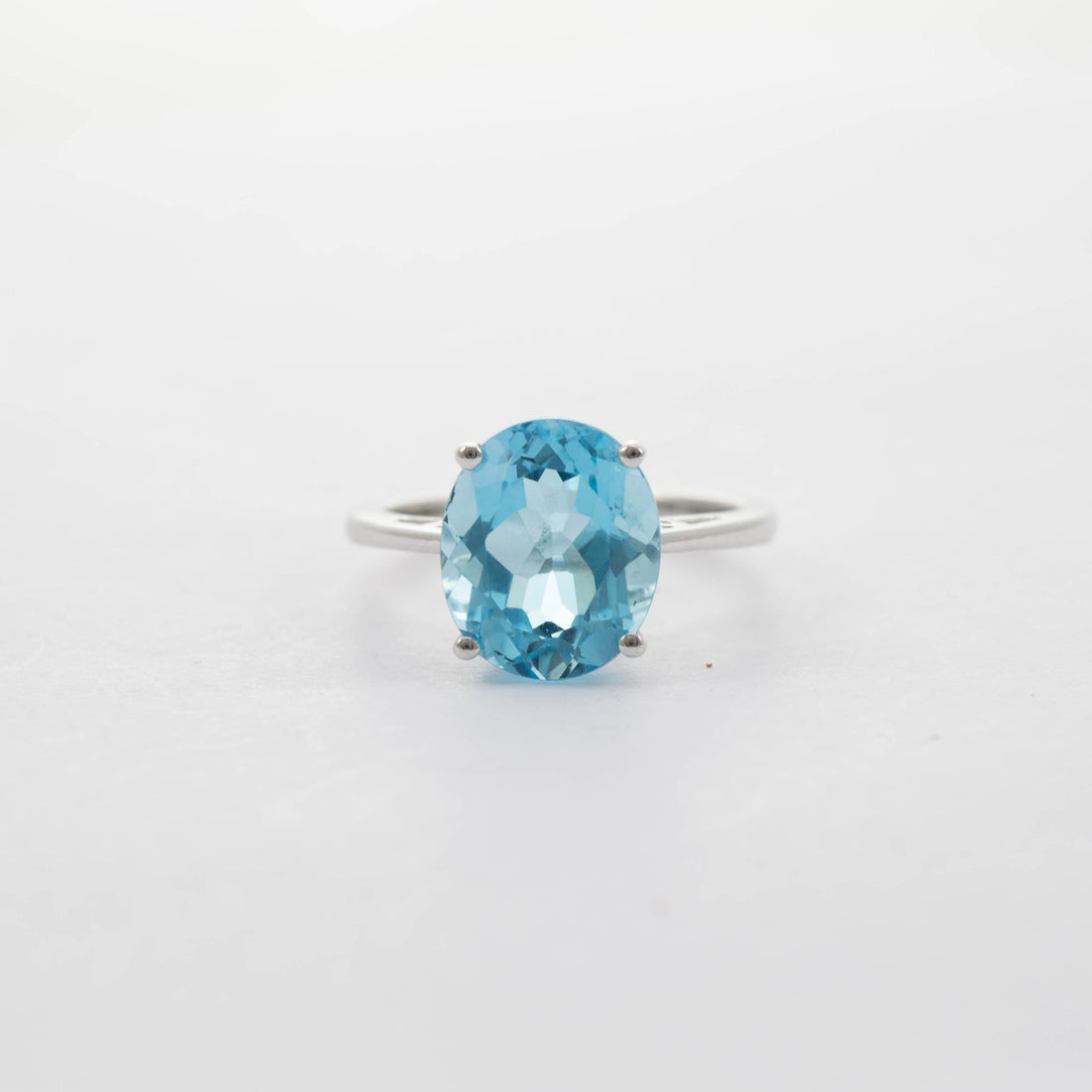 9CT WG LARGE OVAL BLUE TOPAZ SOLITAIRE RING 6.35CT