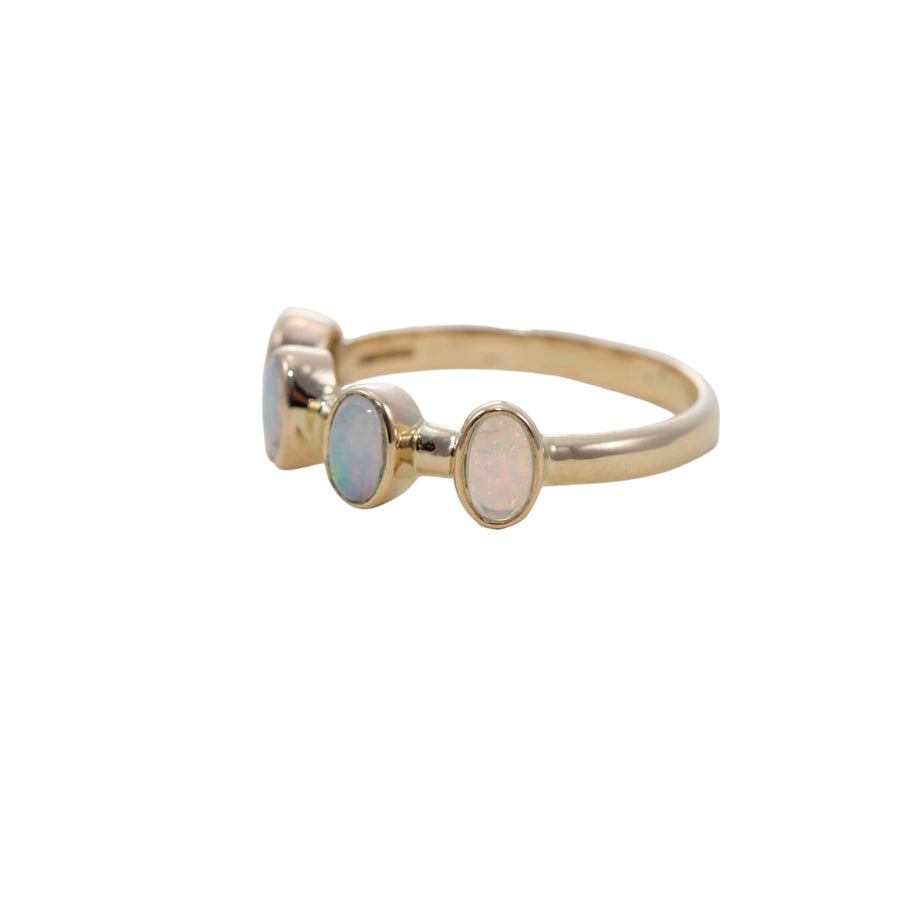 Solid opal four stone ring